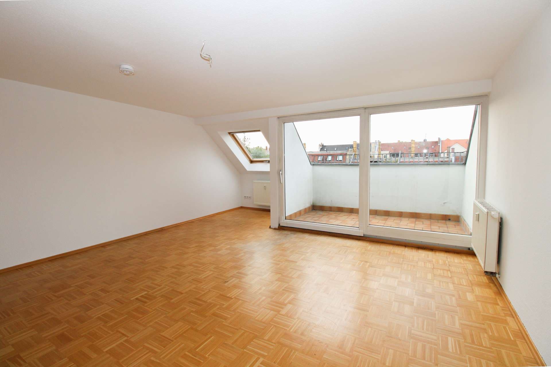 Dachgeschosswohnung mit offenem Wohnkonzept und ruhiger Loggia im Denkmal