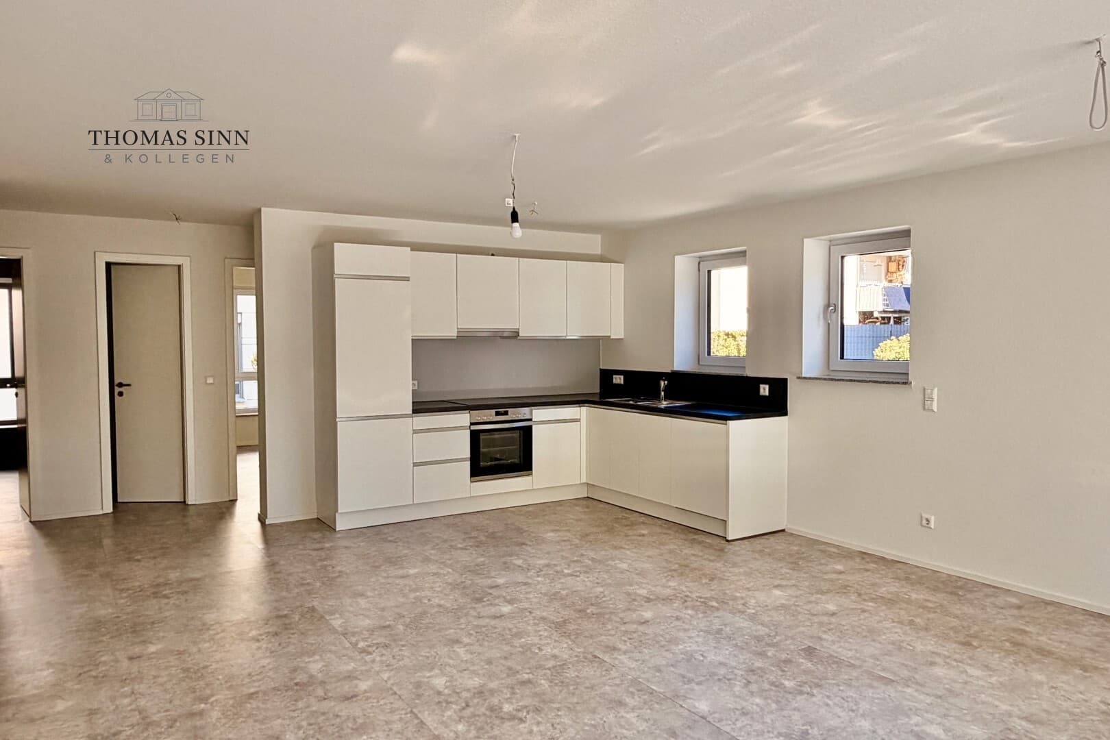 Neuwertige 3-Zimmer-Erdgeschosswohnung mit Terrasse TG- und Außenstellplatz