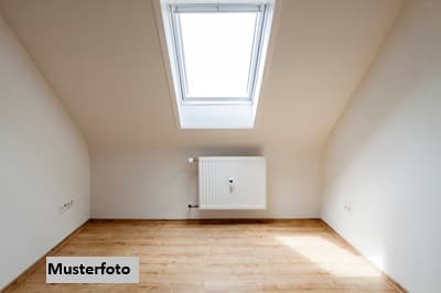 Attraktive DG-Wohnung mit Balkon und seltenem Gartenanteil