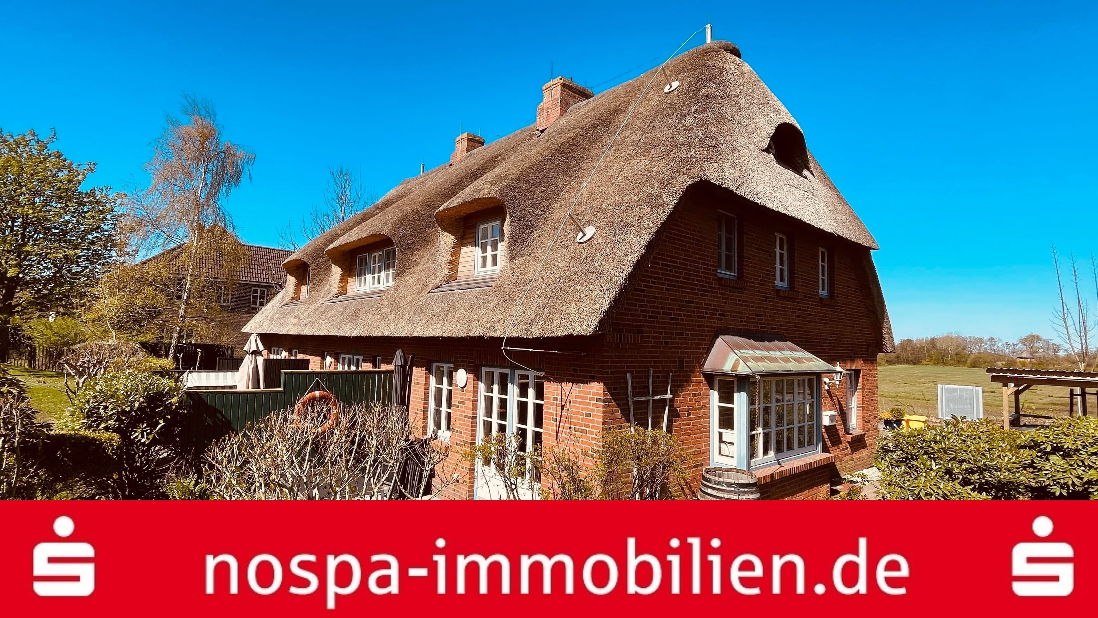 Erdgeschosswohnung mit Terrasse unter Reet