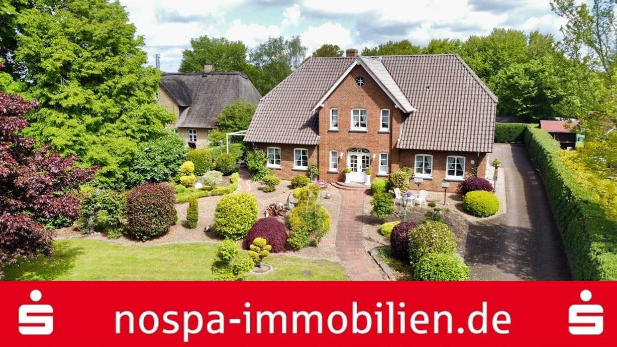 Gepflegtes Wohnhaus mit 4 Wohneinheiten im Zentralort Ostenfeld