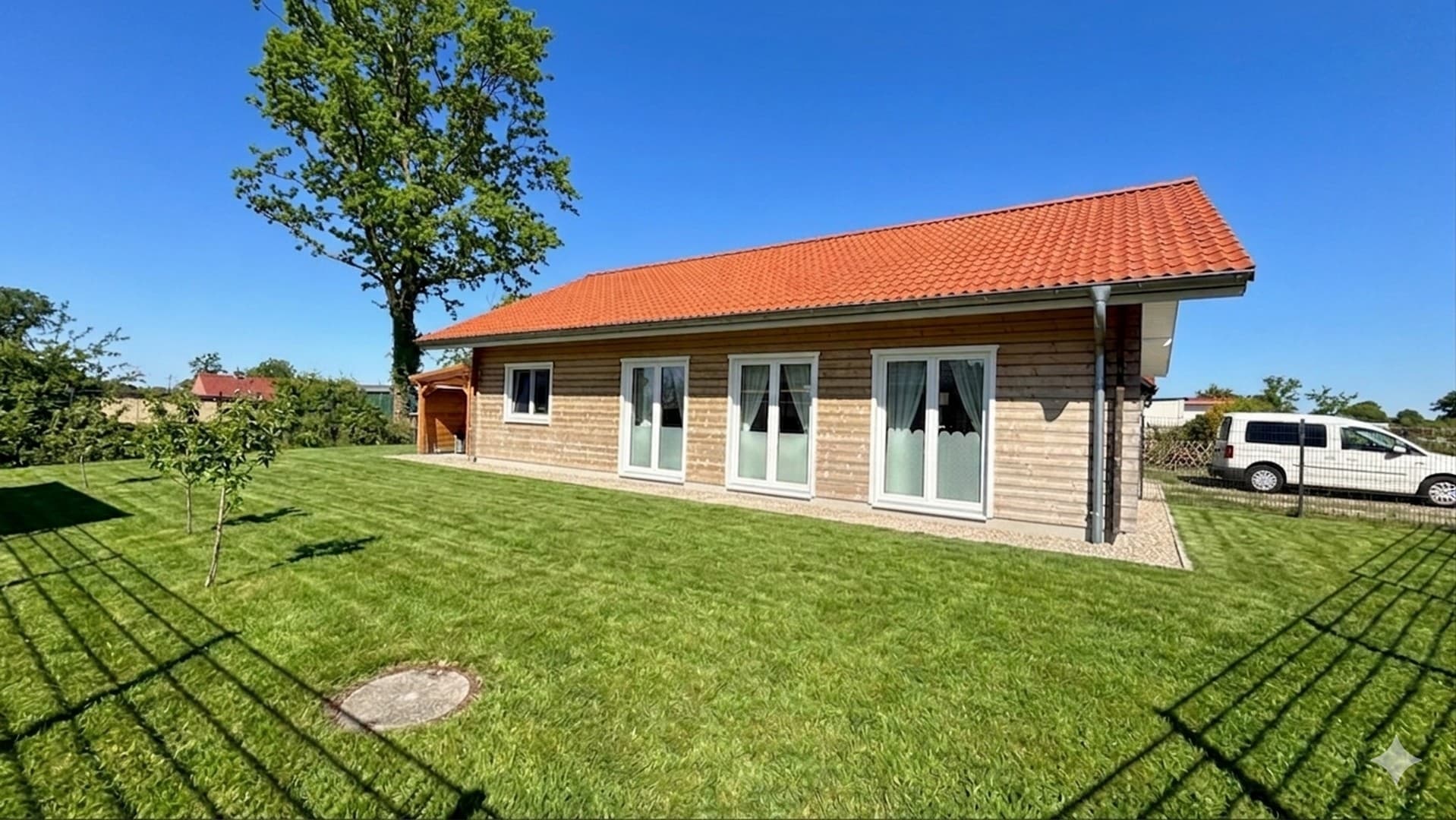 Neuwertiger A+-Holzbungalow nahe der Eider – Garten, Feldblick, provisionsfrei