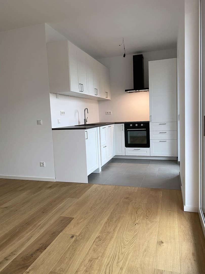 Lichtdurchflutete 2.5-Zimmer-Neubauwohnung mit Eichenparkett, Balkon & EBK