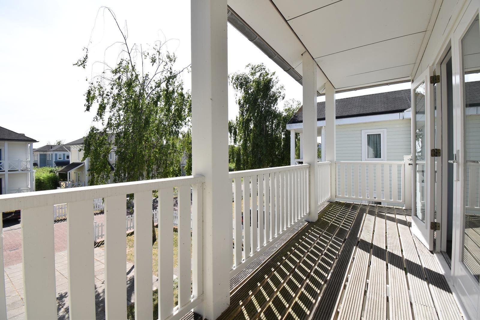 ferienwohnung-schlafzimmer-cape-helius-balcony-zugang-boxspring01