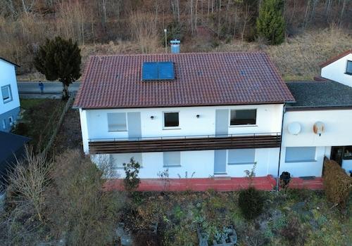 Rückseite mit einem Gartenteil