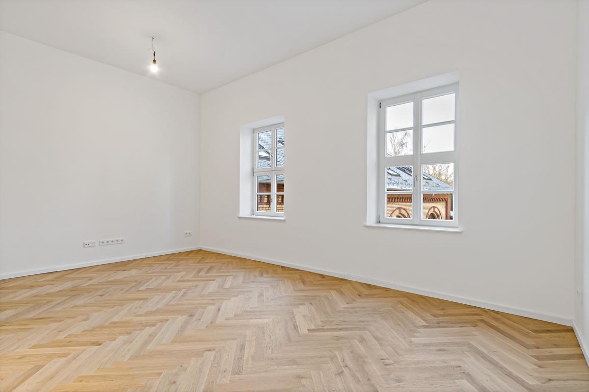 Wohnzimmer mit offener Küche