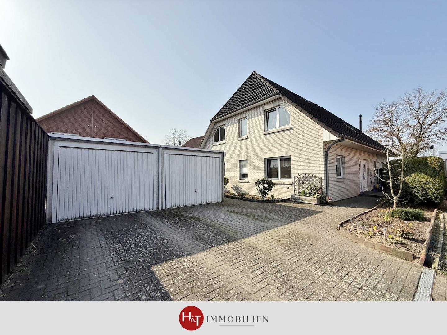 H&T Immobilien - Zweifamilienhaus in Stuhr