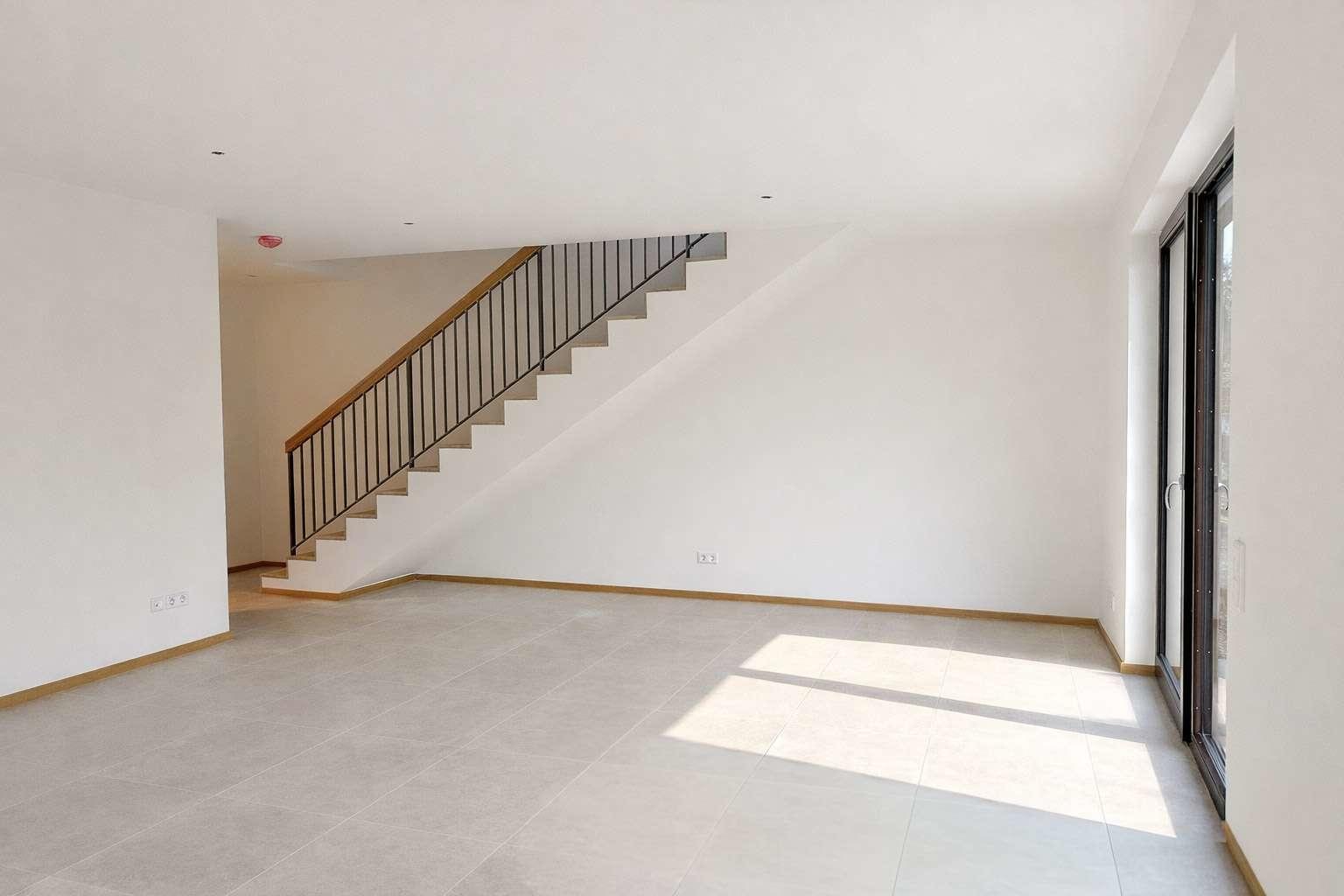 Wohnzimmer mit Treppenaufgang