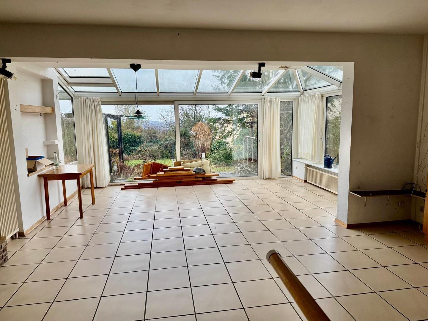 Wohnzimmer mit Wintergarten