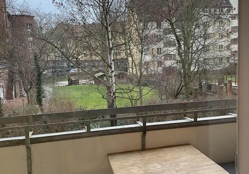 balkony with table and bank