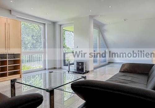 Wohnzimmer mit Loggia im OG