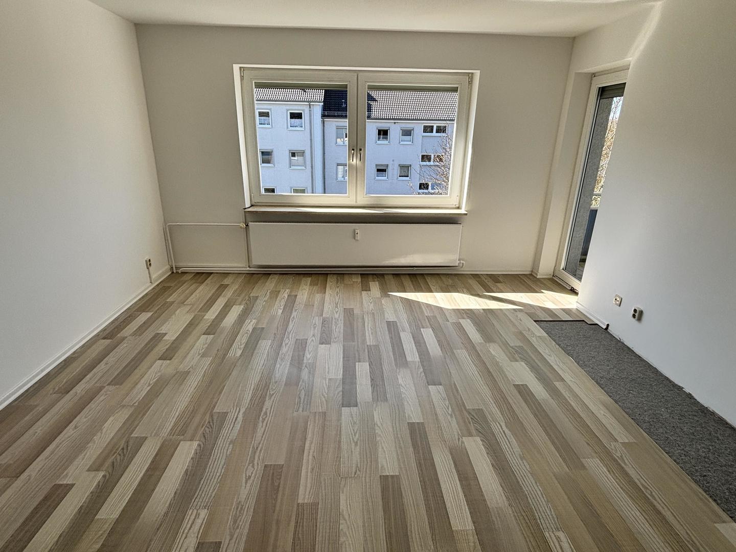 Wohnzimmer mit Zugang zur Loggia