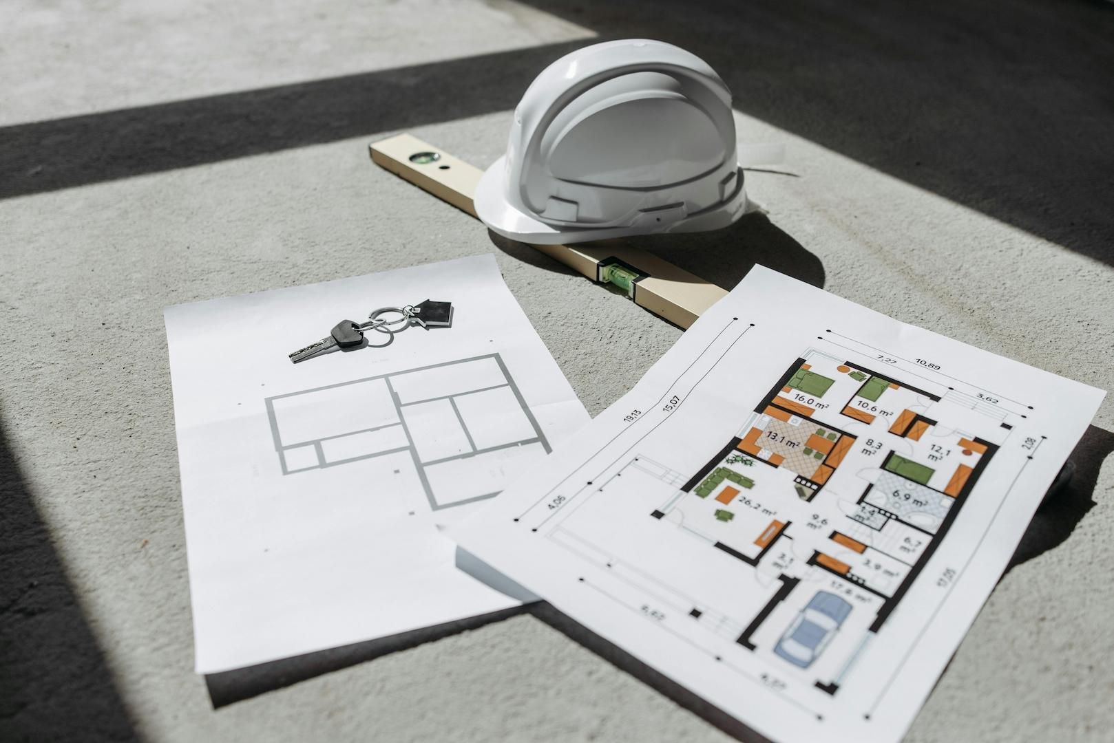architectural-floor-plans-with-helmet-and-keys-on-sunlit-floor-perfect-for-real-estate-or-construction-themes-NWpfICtzGTtnATUnEGfGew