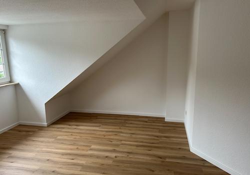 Schlafzimmer mit Arbeitsbereich
