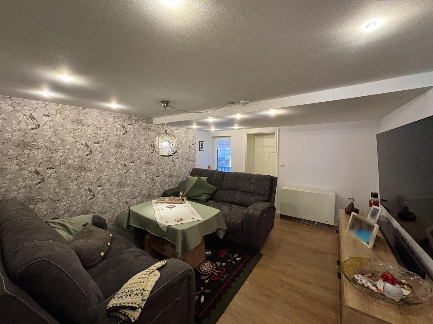 Wohnzimmer in Wohnung 1