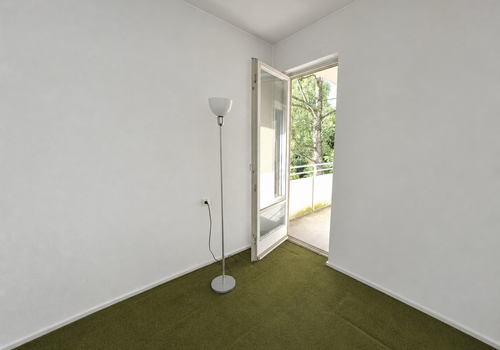 Schlafzimmer mit Balkontür