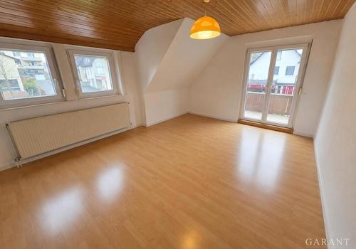 Wohnzimmer mit Balkon WHG DG