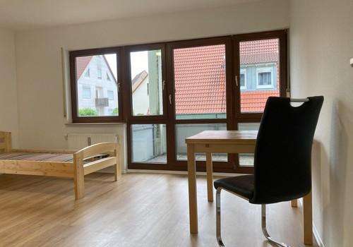 Wohnzimmer mit Balkon