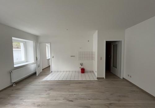 Wohnzimmer mit Küche