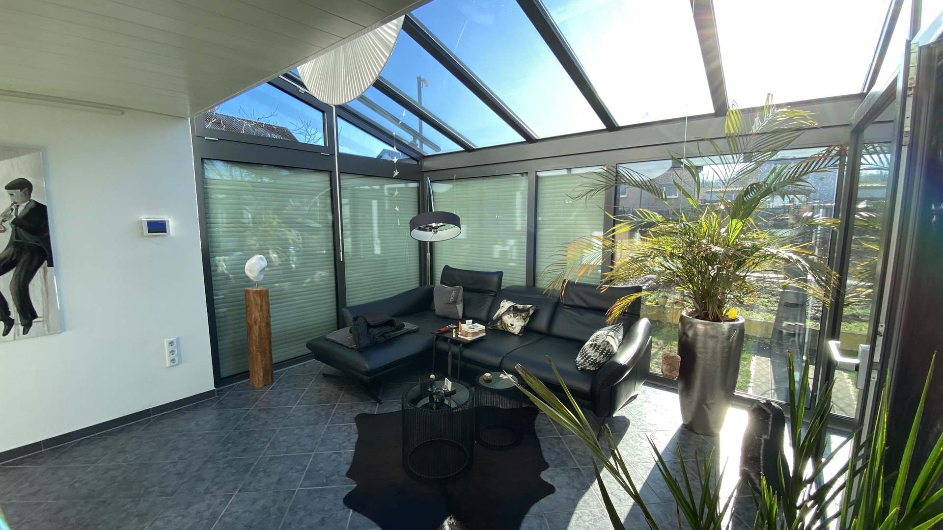 Wohnzimmer mit Wintergarten