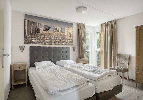 kaufen-freistehendes-ferienhaus-ouddorp-schlafzimmer-en-suite-und-badezimmer-recreatieadviseurs-vakantiehuistekoop-nl.jpg