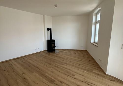 Wohn-/Esszimmer mit Ofen