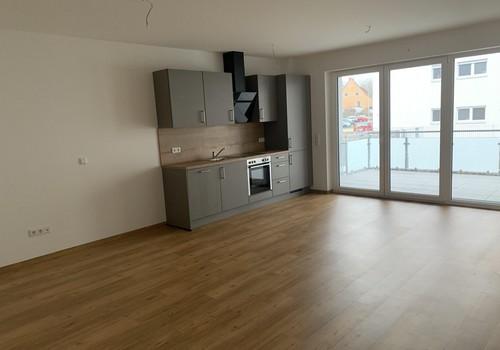Wohnraum mit Einbauküche