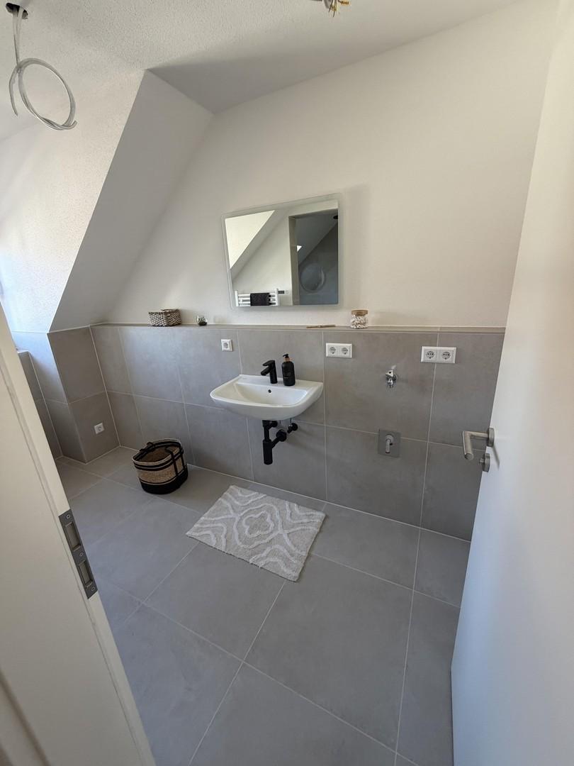 Badezimmer mit Waschmaschine