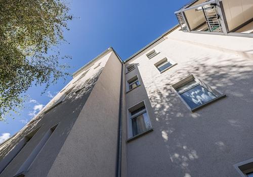 Wohn- und Geschäftshaus | Fassade - Gartenseite