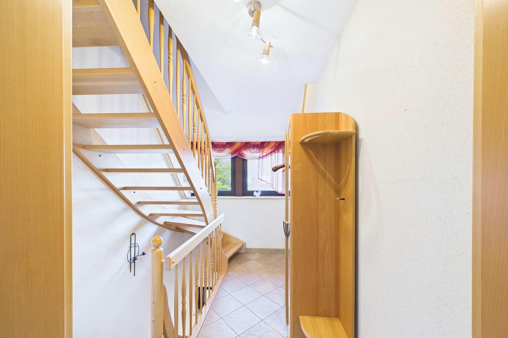 Treppenaufgang in die ausgebaute Dachspitze
