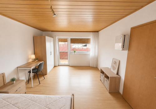 Schlafzimmer mit Balkonzugang