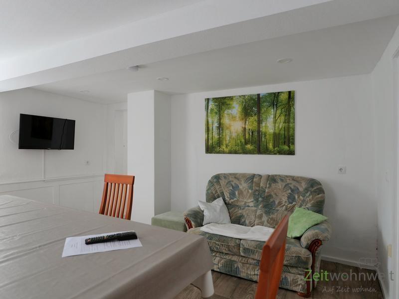 EG, TV und Sofa im Esszimmer